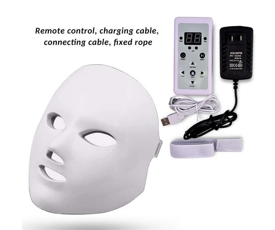 Woman using Led Facial beauty instrument with pink LED lights for skincare rejuvenation and treatment.