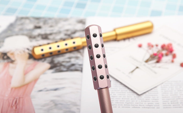 30 Germanium Beauty Stick Massage in use on facial skin, highlighting its massaging stones functionality.